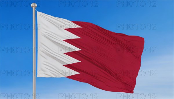 The flag of Bahrain flutters in the wind, isolated against a blue sky