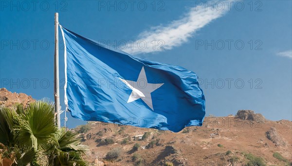 The flag of Somalia, fluttering in the wind, isolated, against the blue sky