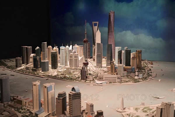 A detailed model of a city with miniature buildings and distinctive structures, Shanghai, China, Asia
