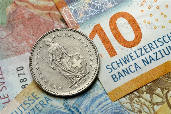 Swiss coin on banknotes, Swiss franc, Switzerland, Europe