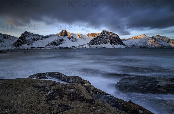 Rocky coast off Bergen, sea, waves, spray, morning mood with clouds, long exposure, winter, Tungeneset, Senja, Troms, Norway, Europe