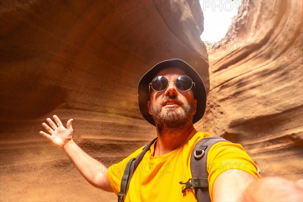 Selfie of a tourist enjoying in the limestone canyon Barranco de las Vacas in Gran Canaria, Canary Islands