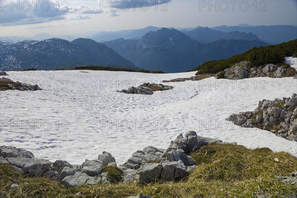 Amazing mountains panorama from 5 Fingers viewing platform in the shape of a hand with five fingers on Mount Krippenstein in the Dachstein Mountains of Upper Austria, Salzkammergut region, Austria, Europe