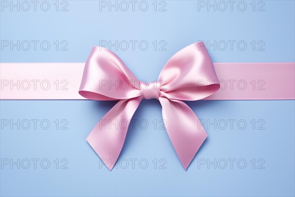 Pink tied ribbon on blue bakcground. KI generiert, generiert, AI generated