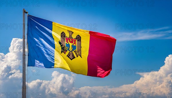 The flag of Moldova, Republic of Moldova, flutters in the wind, isolated against a blue sky