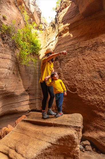 Family on vacation enjoying in the limestone canyon Barranco de las Vacas in Gran Canaria, Canary Islands