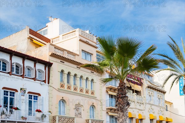 Row of houses on the beach promenade in Sitges, Spain, Europe