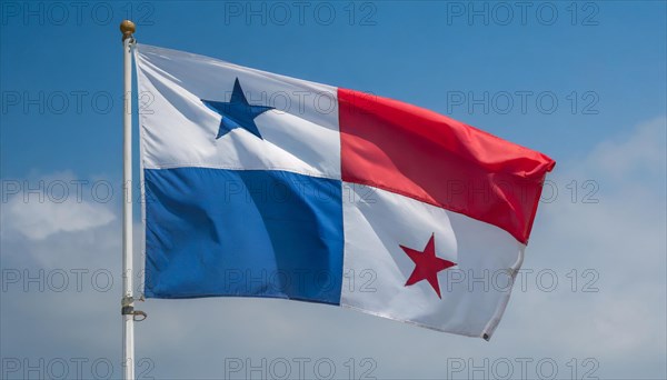 The flag of Panama flutters in the wind, isolated against a blue sky