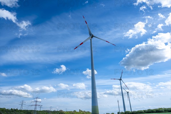 Power pylons with high-voltage lines and wind turbines near the Avacon substation Helmstedt, Helmstedt, Lower Saxony, Germany, Europe