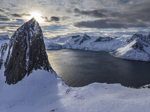 Aerial view of Bergen by the sea, fjord, sunbeams, winter, snow, Mount Segla, Senja, Troms, Norway, Europe