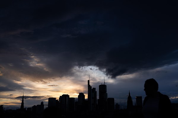 Dense clouds pass over the Frankfurt banking skyline in the evening, Floesserbruecke, Frankfurt am Main, Hesse, Germany, Europe