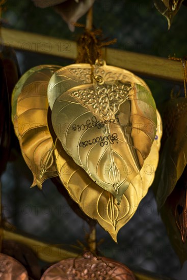 Inscribed gold plates from wishing bells or offering bells, Golden Mount, Bangkok, Thailand, Asia