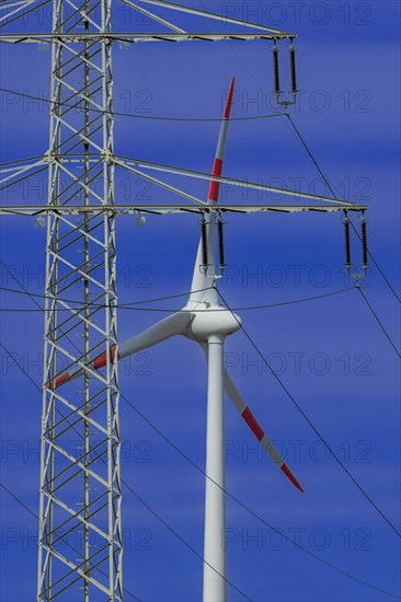 Power pylon with high-voltage lines and wind turbines at the Avacon substation Helmstedt, Helmstedt, Lower Saxony, Germany, Europe