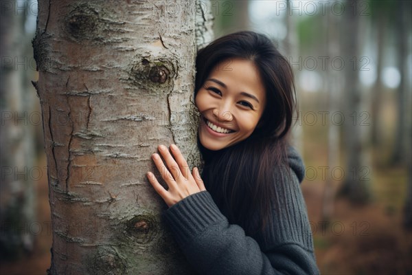Young Asian woman hugging tree. KI generiert, generiert, AI generated