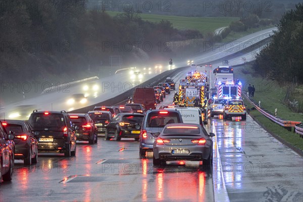 Traffic jam after an accident on the A5 motorway on a wet road, Nieder-Ohmen, Hesse, Germany, Europe