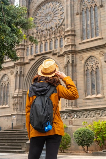 A tourist visiting the Church of San Juan Bautista, Arucas Cathedral, Gran Canaria, Spain, Europe