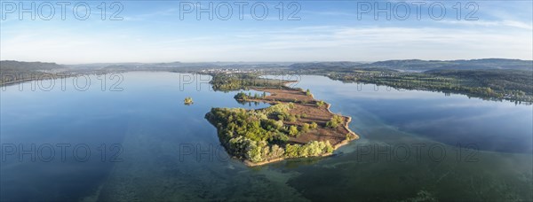 Aerial view, panorama of the Mettnau peninsula with spring-like vegetation, on the horizon the town of Radolfzell on Lake Constance, behind it the Hegau mountains, district of Constance, Baden-Wuerttemberg, Germany, Europe