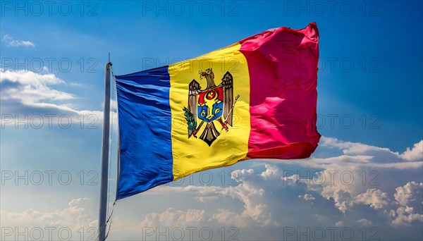 The flag of Moldova, Republic of Moldova, flutters in the wind, isolated against a blue sky