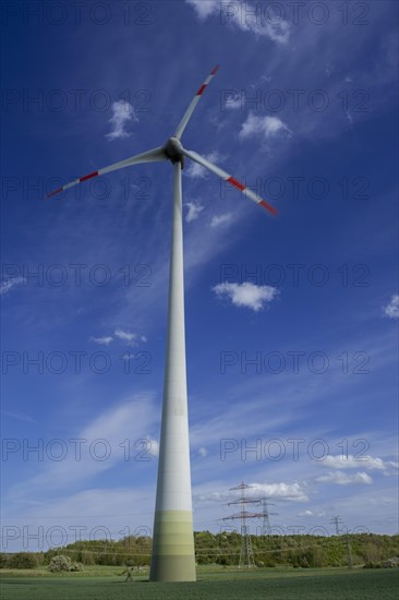 Wind turbine and high-voltage pylons near the Avacon substation Helmstedt, Helmstedt, Lower Saxony, Germany, Europe