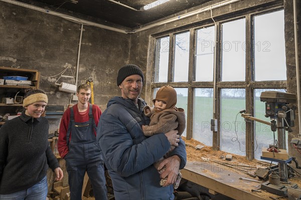 Family reunion in the workshop, father, daughter, son and grandson, Mecklenburg-Vorpommern, Germany, Europe