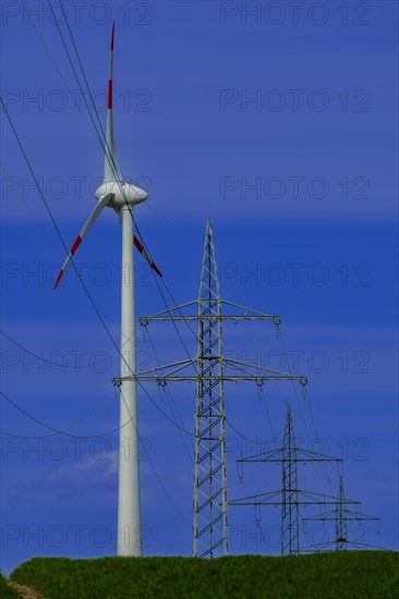 Power pylons with high-voltage lines and wind turbines at the Avacon substation in Helmstedt, Helmstedt, Lower Saxony, Germany, Europe