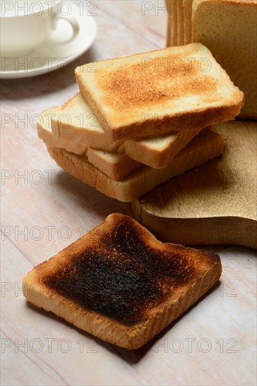 Burnt slice of toast with toast, toast