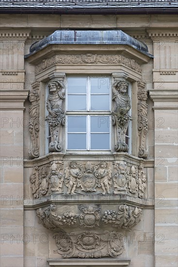 Historic bay window with ecclesiastical coats of arms and figures, Ebrach Monastery, Ebrach, Lower Franconia, Bavaria, Germany, Europe