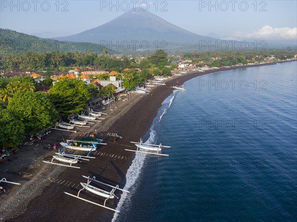 Fishermen coming back from fishing in the morning, in the background Mount Agung, Amed, Karangasem, Bali, Indonesia, Asia