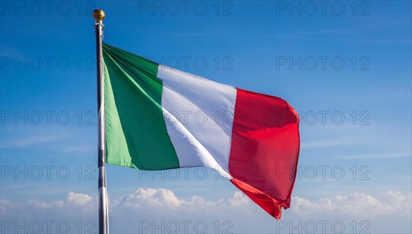 The flag of Italy flutters in the wind, isolated against a blue sky