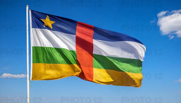 The flag of the Central African Republic, fluttering in the wind, isolated, against the blue sky