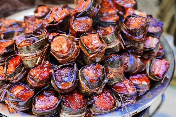 Supermarket, Vegetable market in the centre of Shanghai, China, Asia, A stack of Zongzi, traditional Chinese rice packets wrapped in banana leaves, Shanghai, Asia