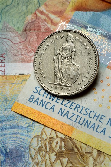 Swiss coin on banknotes, Swiss franc, Switzerland, Europe