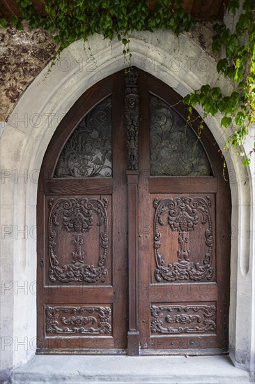 Richly decorated portal on the historic town hall from the 15th century in the old town centre of Isny im Allgaeu, Baden-Wuerttemberg, Germany, Europe