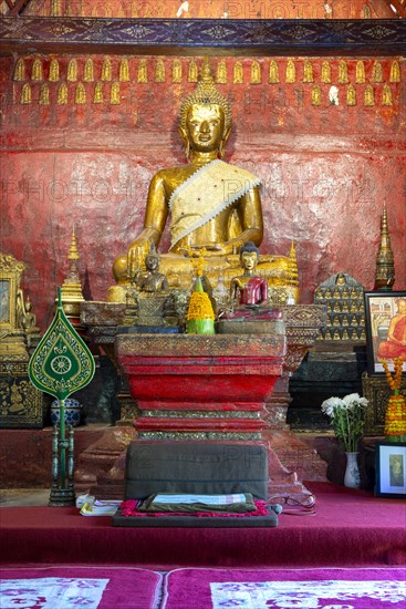 Golden Buddha statue, Bhumispara-mudra, Buddha Gautama at the moment of enlightenment, Wat Long Koon, Luang Prabang, Laos, Asia