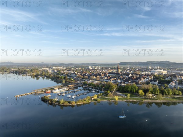 Aerial view of the town of Radolfzell on Lake Constance in spring-like vegetation with the Waeschbruck harbour, harbour pier and concert sail, district of Constance, Baden-Wuerttemberg, Germany, Europe