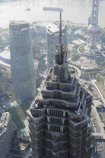 View from the 632 metre high Shanghai Tower, nicknamed The Twist, Shanghai, People's Republic of China, The facade of a skyscraper with the silhouette of a television tower in the background, Shanghai, China, Asia