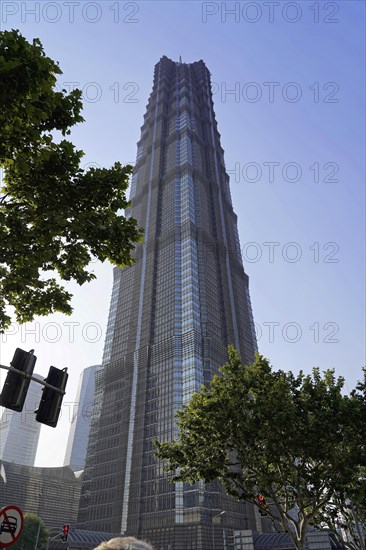 Jin Mao Tower, nicknamed The Syringe at 420 metres, a skyscraper with an impressive facade rises into the blue sky, Shanghai, China, Asia