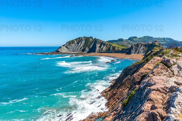 View of Itzurun beach from Cala de Algorri in the Flysch Basque Coast geopark in Zumaia, Gipuzkoa