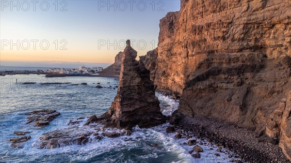 Aerial view of the cliffs and coast of Agaete at summer sunset in Gran Canaria. Spain