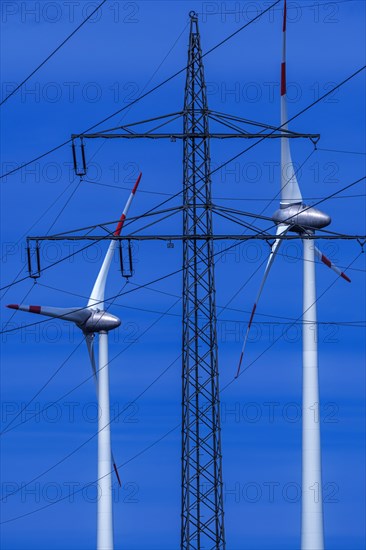 Power pylon with high-voltage lines and wind turbines at the Avacon substation Helmstedt, Helmstedt, Lower Saxony, Germany, Europe