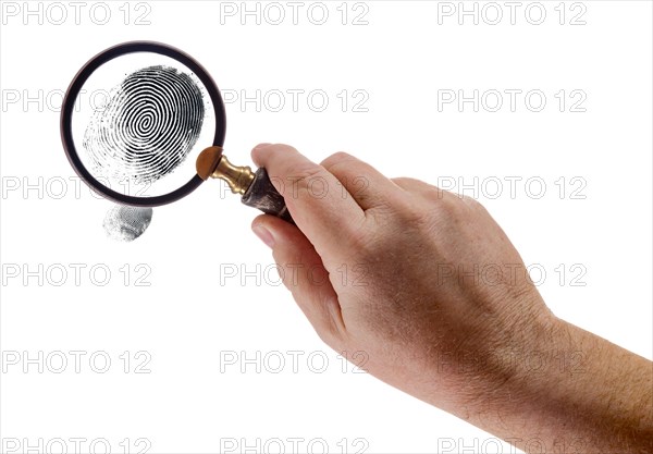 Male hand holding magnifying glass viewing A fingerprint on a white background