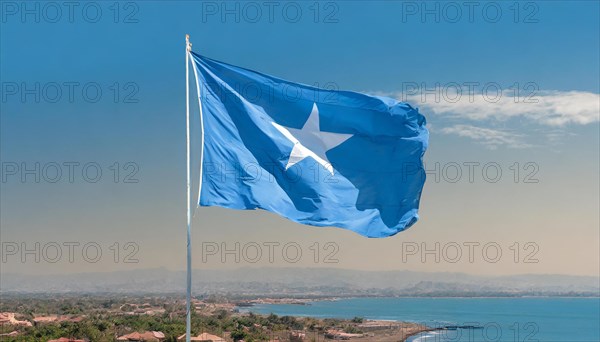 The flag of Somalia, fluttering in the wind, isolated, against the blue sky