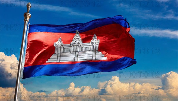 The flag of Cambodia, fluttering in the wind, isolated, against the blue sky