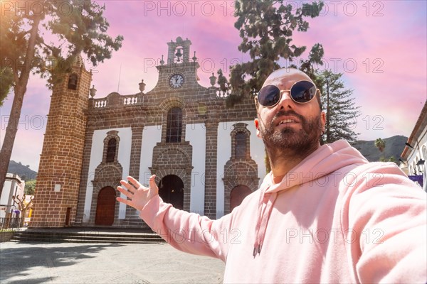 Selfie of a tourist at sunset next to the Basilica of Nuestra Senora del Pino in the municipality of Teror. Gran Canaria, Spain, Europe