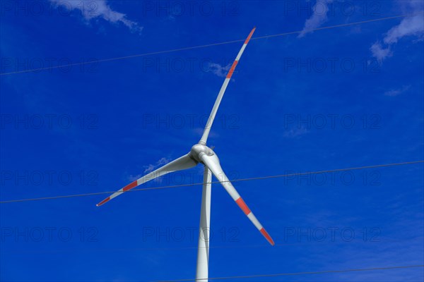 Wind turbine and high-voltage lines at the Avacon substation in Helmstedt, Helmstedt, Lower Saxony, Germany, Europe