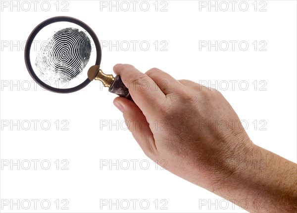 Male hand holding magnifying glass viewing A fingerprint on a white background