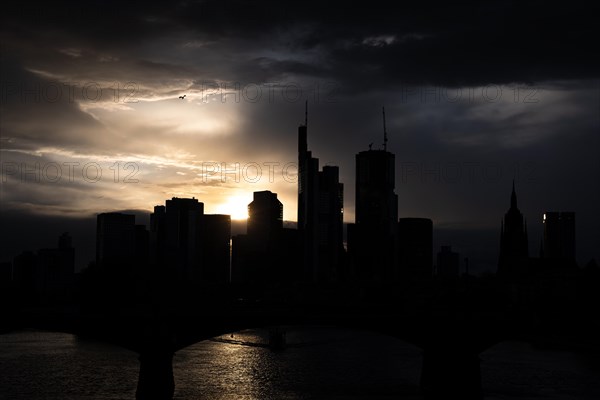 Dense clouds pass over the Frankfurt banking skyline in the evening, Floesserbruecke, Frankfurt am Main, Hesse, Germany, Europe