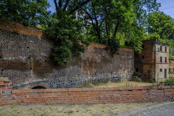 Abandoned, dilapidated building, integrated into the old historic town wall of Namyslow (Namslau), Opole Voivodeship, Poland, Europe