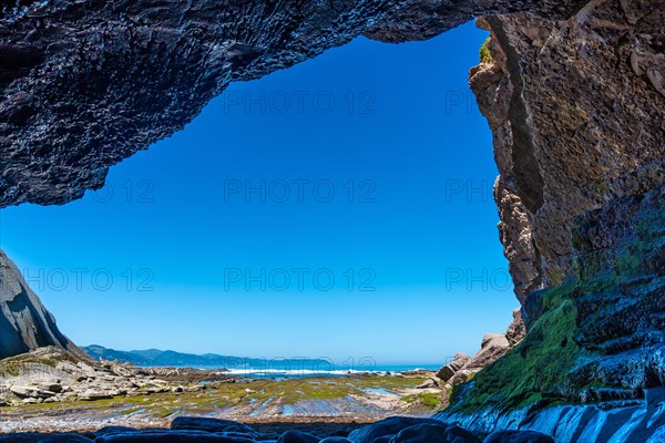 Sea cave in Algorri cove on the coast in the Zumaia flysch without people, Gipuzkoa. Basque Country