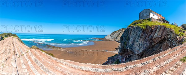 Panoramic view of Itzurun beach in the Flysch Basque Coast geopark in Zumaia, Gipuzkoa